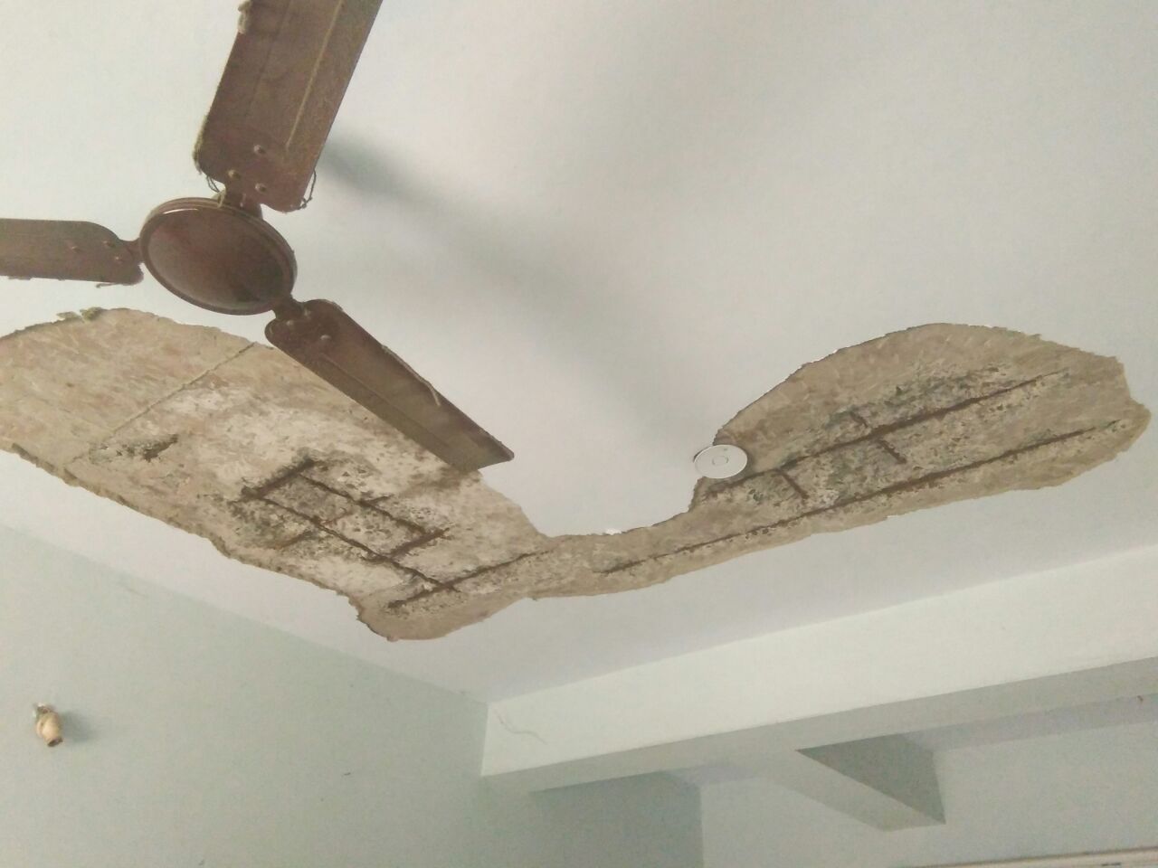 Spalled ceiling before repair